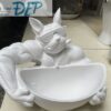tượng tô màu chú chó thể hình ngậm thuốc